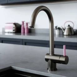 The Tap Factory Vibrance 1 Gunmetal Single Lever Mono Kitchen Mixer With Post Box Red Handle -Vado Shop tap factory vibrance 1 gunmetal with pink handle lifestyle