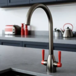 The Tap Factory Vibrance 2 Gunmetal Twin Lever Mono Kitchen Mixer With Post Box Red Handles -Vado Shop tap factory vibrance 2 gunmetal with red handle lifestyle