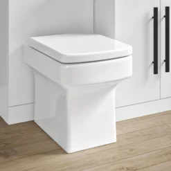 Vellamo Aspire 1100mm Gloss White 2 Door Combination Ceramic Basin & Toilet Unit With Matt Black Handles & Overflow - Harbour Clarity Toilet -Vado Shop vellamo aspire back to wall toilet combination unit drawer blackhandle lifestyle2